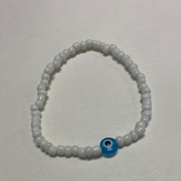 Handmade Jewelry - Handmade White Beaded Bracelet with light blue Evil Eye Accent